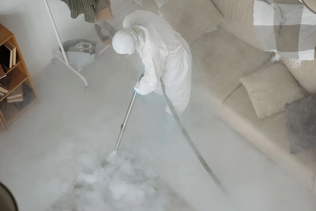 Biohazard cleanup technician in protective equipment, Coon Rapids, IA